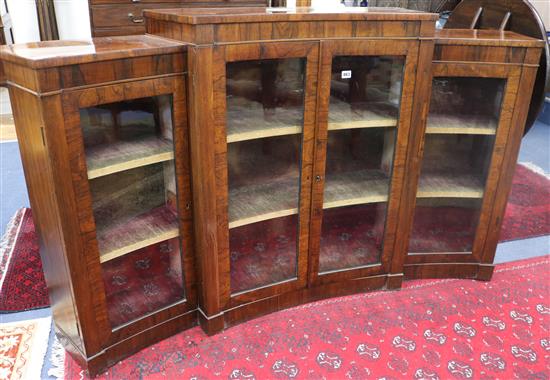 A Victorian rosewood concave dwarf bookcase